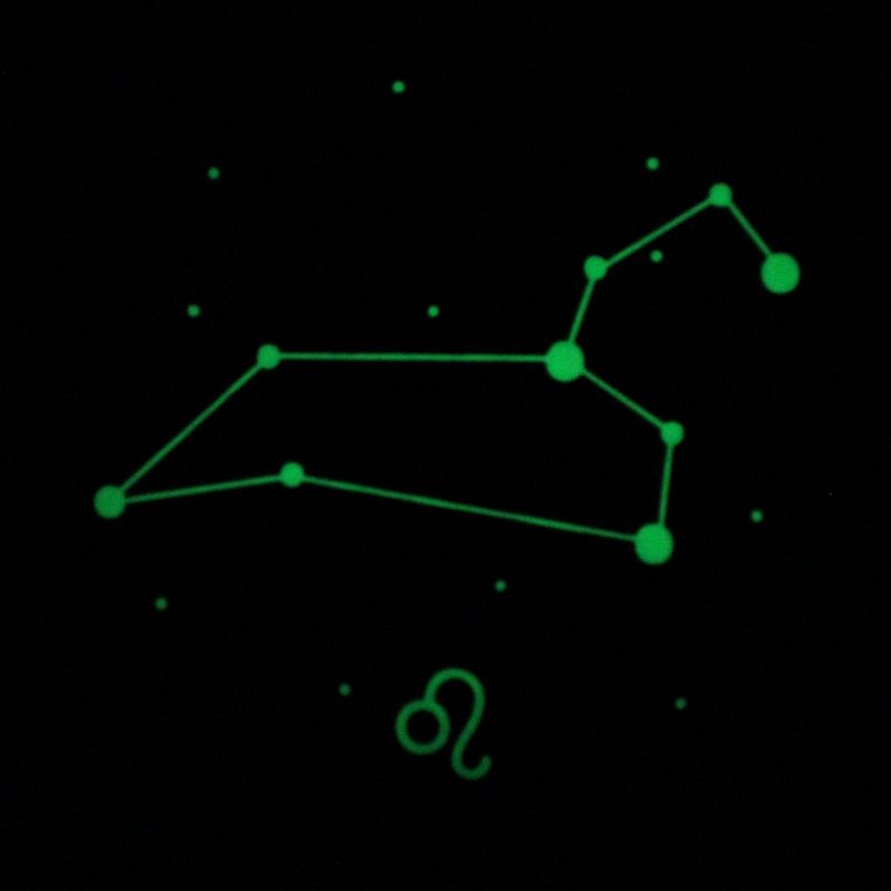 The same Leo piece with the lights out - the constellation, connecting lines and glyph glowing green