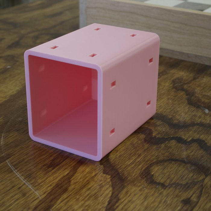 A 4x4 open cubby module in pink