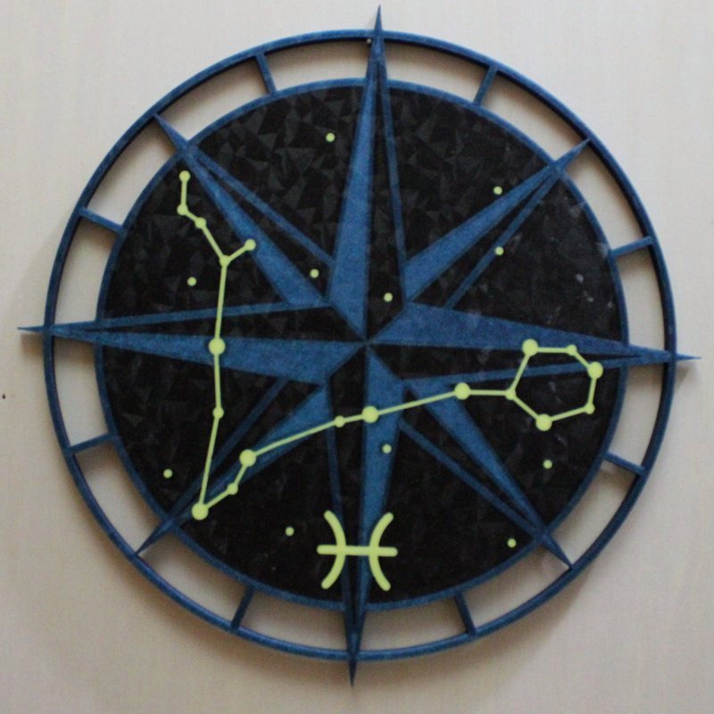 Pisces built the reversed way - blue compass rose and ring over a black sky